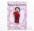 Guatemalan worry doll holding a red heart